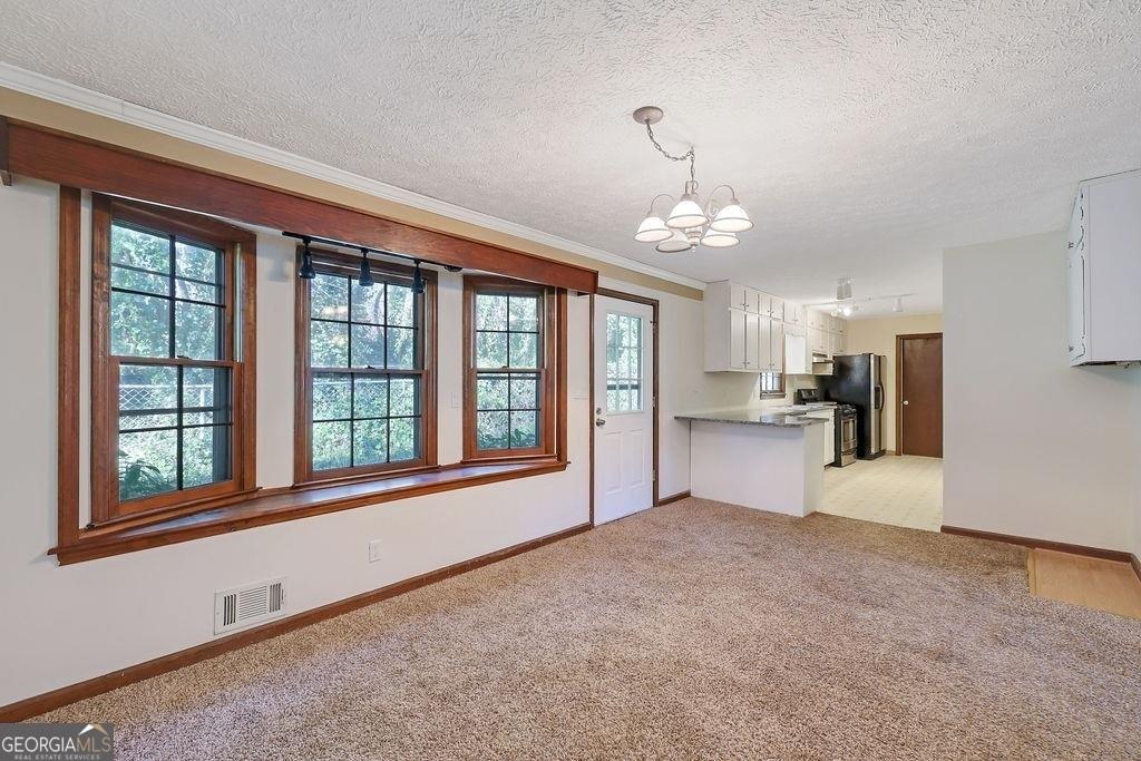 2733 Old Dawsonville Road Gainesville, GA 30506 - Photo 8 of 40 a view of an empty room with a window