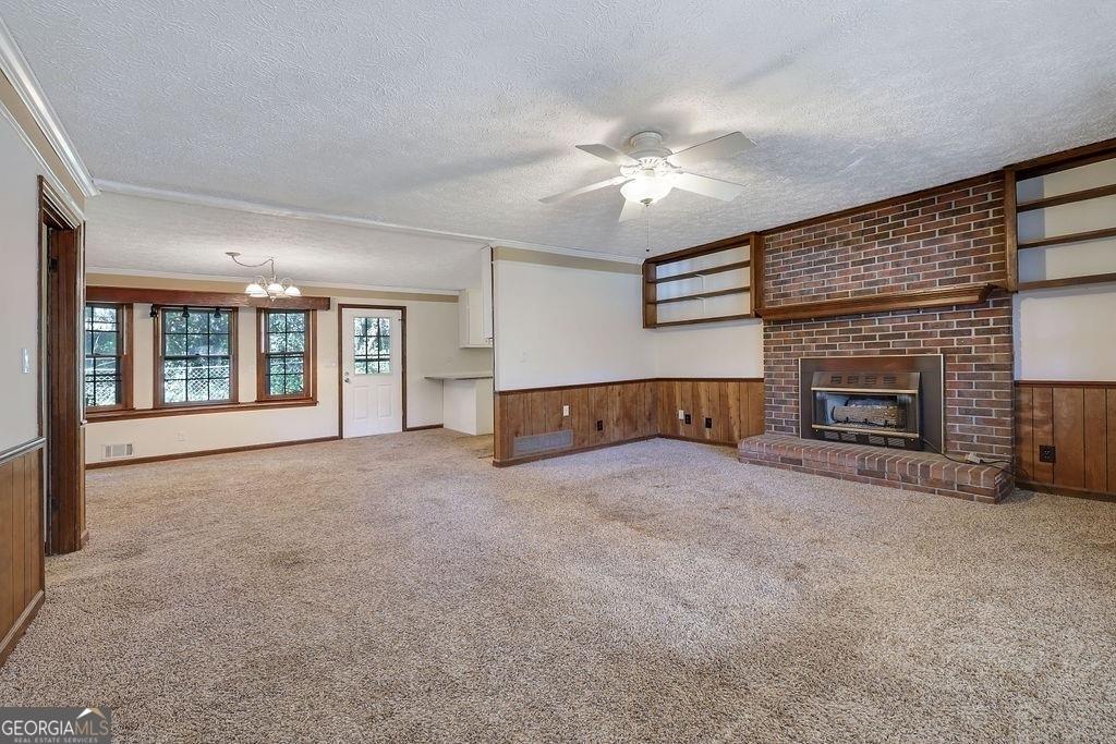 2733 Old Dawsonville Road Gainesville, GA 30506 - Photo 10 of 40 a living room with furniture and a fireplace