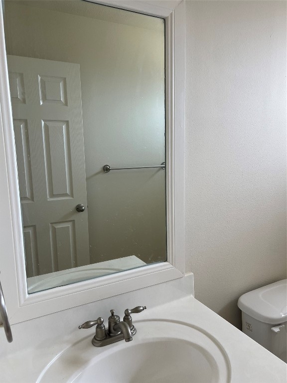 902 Brandy Street Stafford, TX 77477 - Photo 17 of 21 a bathroom with a sink and toilet