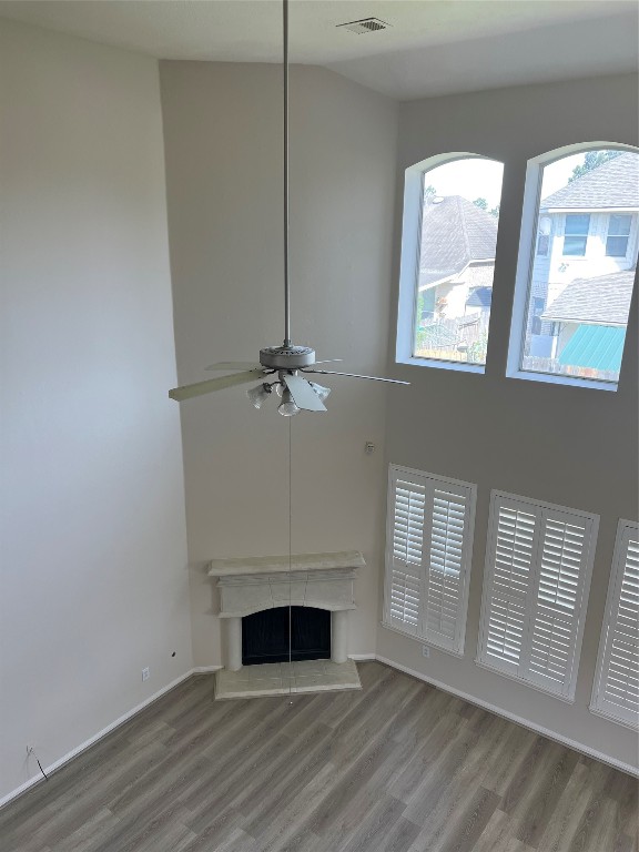 902 Brandy Street Stafford, TX 77477 - Photo 18 of 21 a view of empty room with wooden floor and fan
