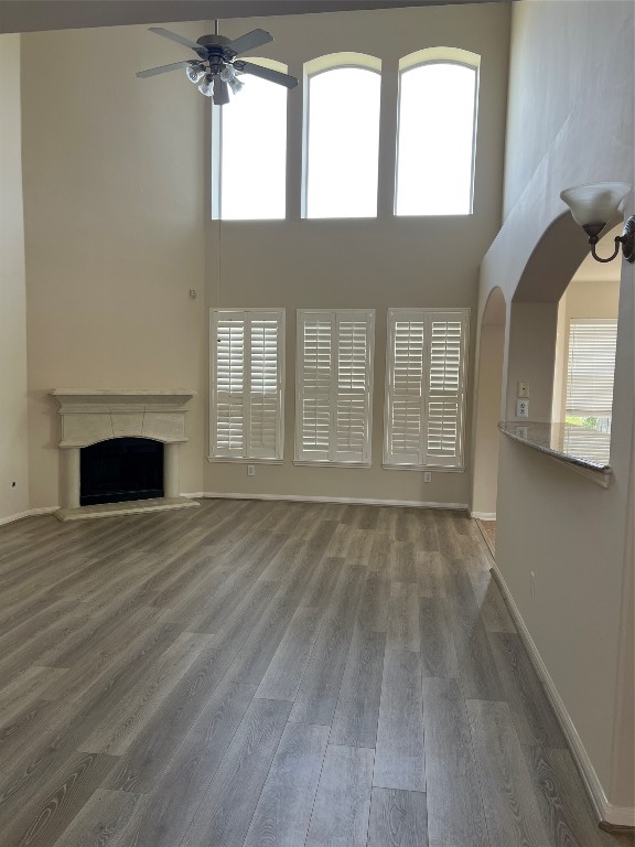902 Brandy Street Stafford, TX 77477 - Photo 2 of 21 a view of an empty room with wooden floor and a window