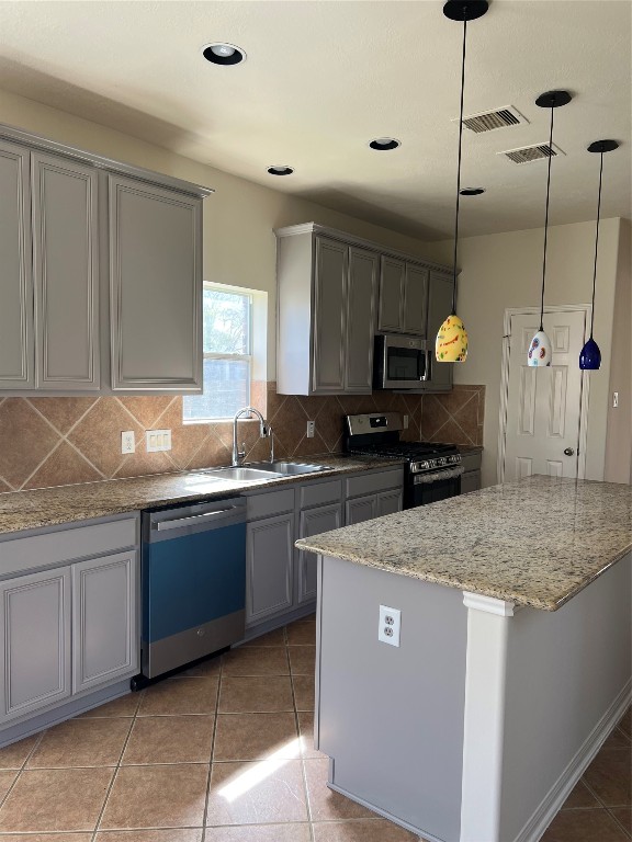 902 Brandy Street Stafford, TX 77477 - Photo 6 of 21 a kitchen with stainless steel appliances granite countertop a sink a stove and a granite counter tops