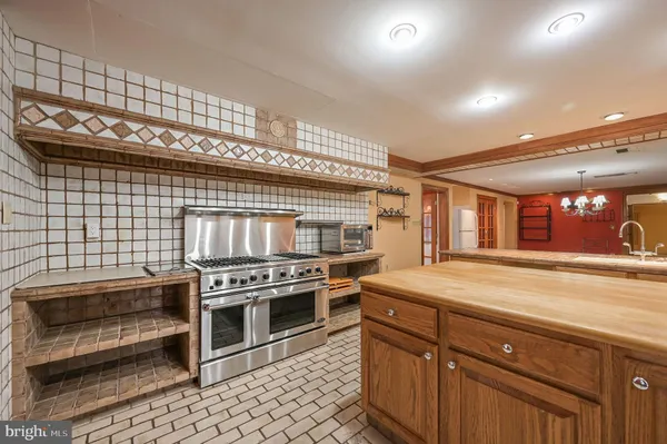 a kitchen with a stove and a refrigerator