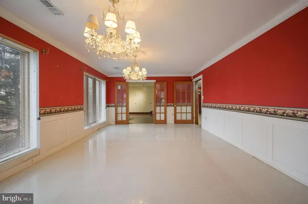 a view of an empty room with windows