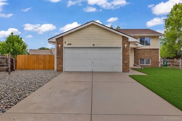 a view of backyard of house with garage