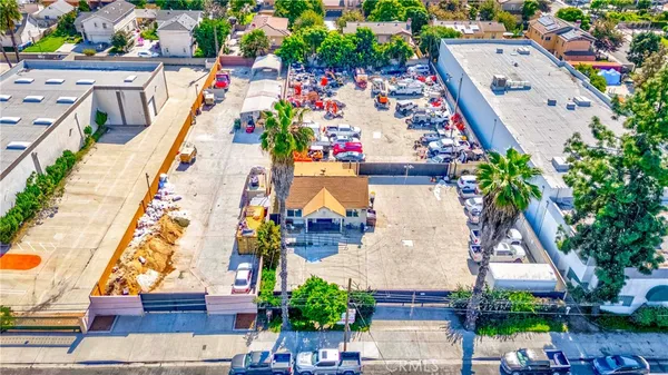an aerial view of multiple houses with yard