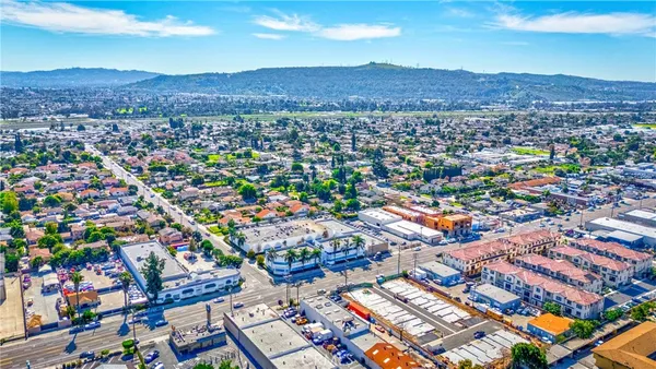 a view of a street with cars on the road