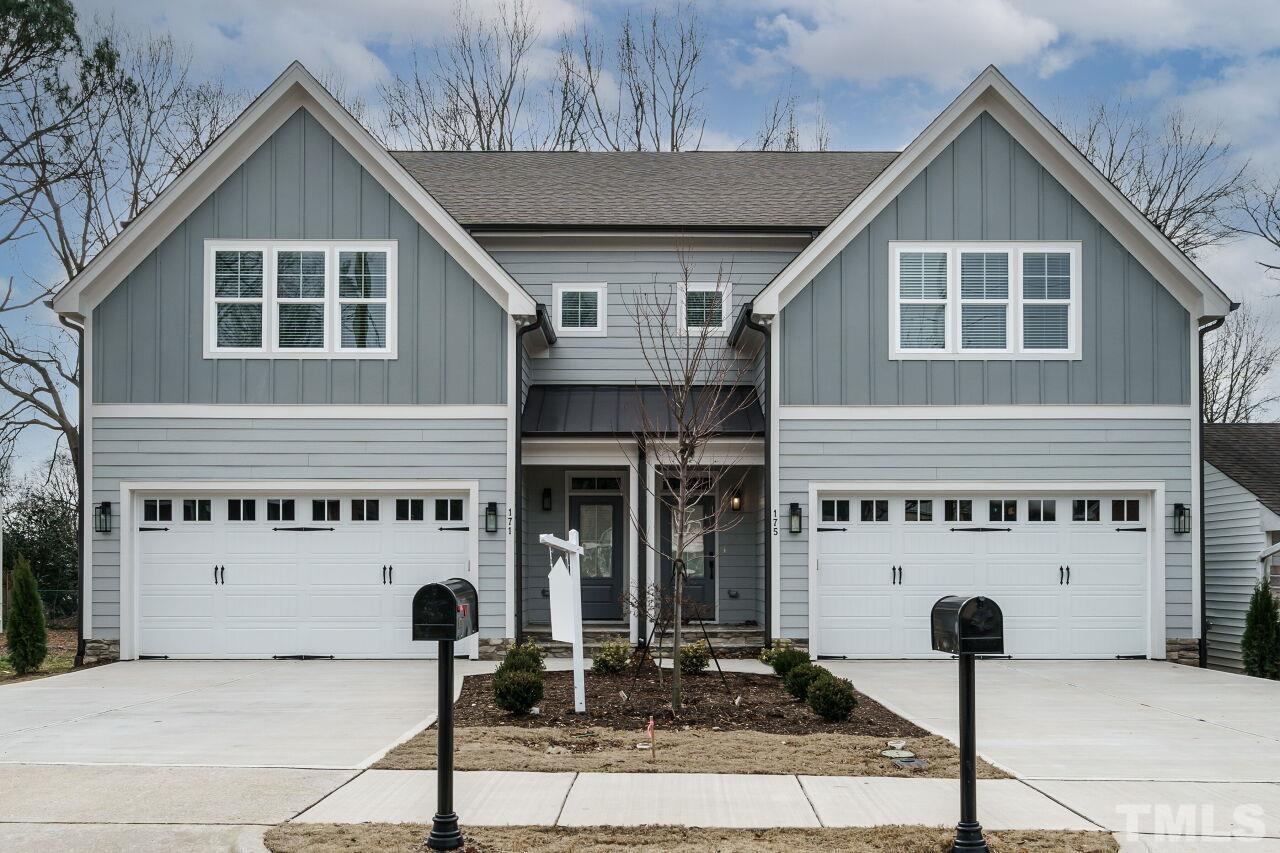 a front view of a house with parking area