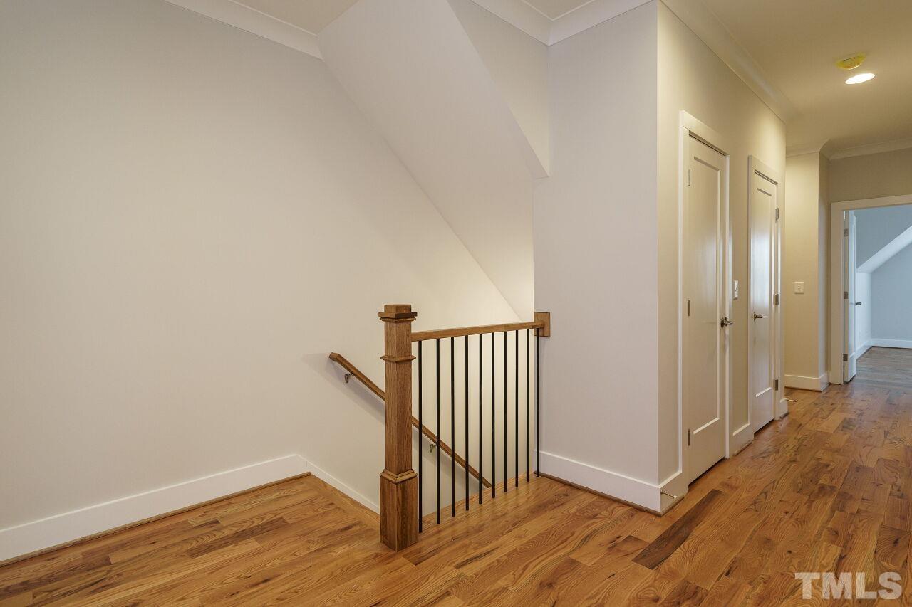171 Adams Street Cary, NC 27513 - Photo 17 of 32 a view of a hallway with wooden floor and entryway