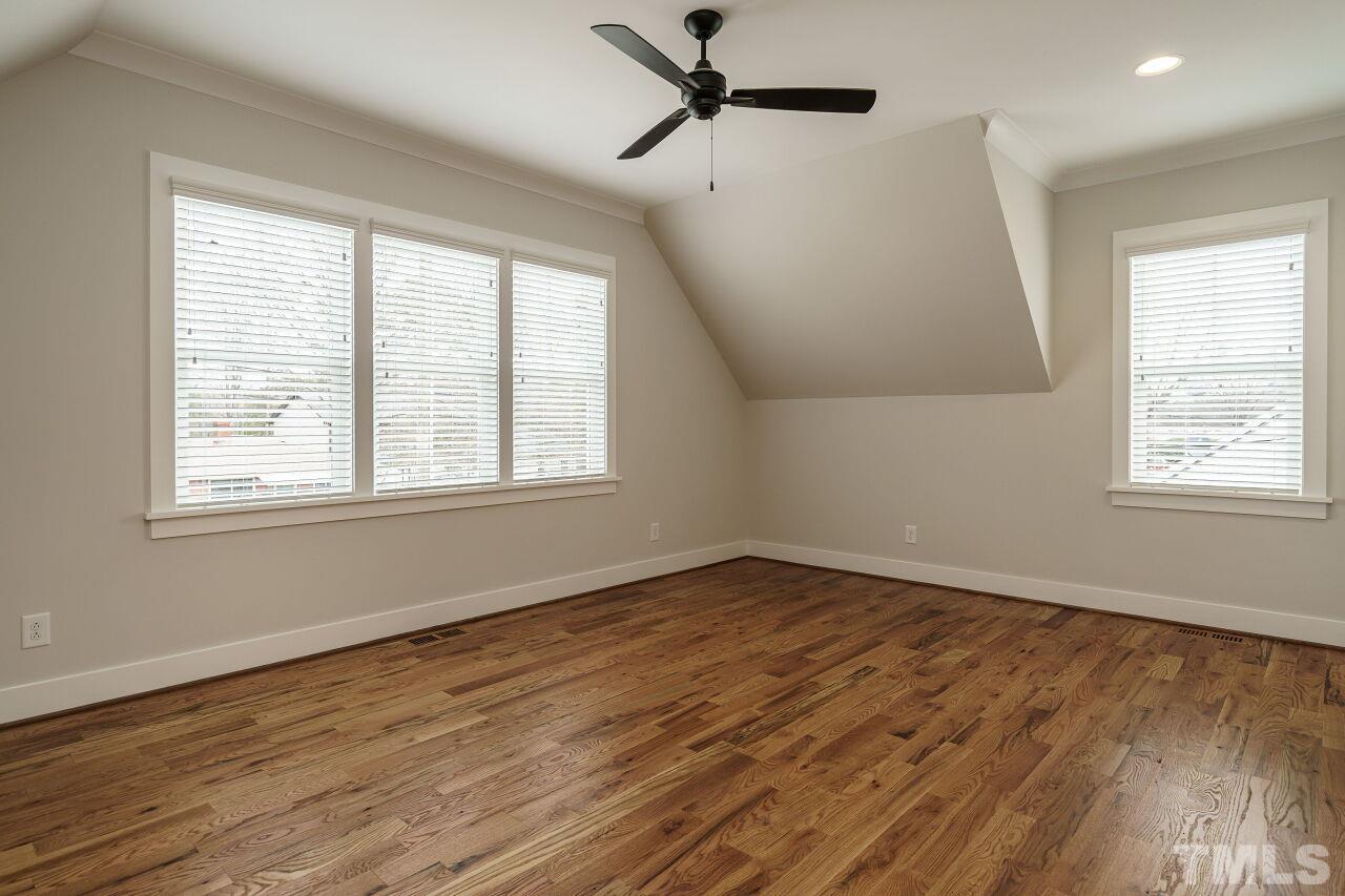 171 Adams Street Cary, NC 27513 - Photo 19 of 32 a view of empty room with wooden floor and fan