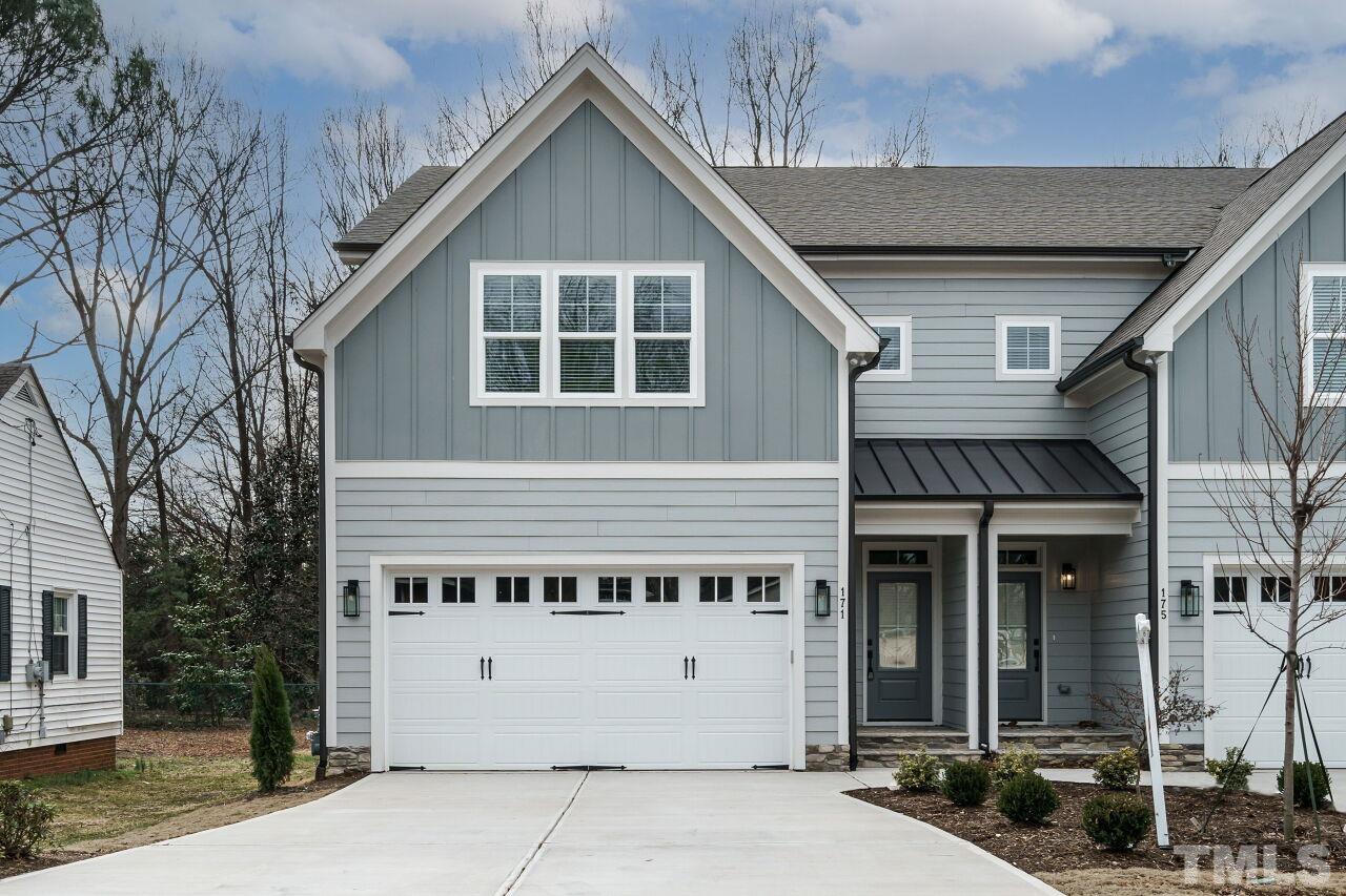 171 Adams Street Cary, NC 27513 - Photo 2 of 32 a view of a house with a yard
