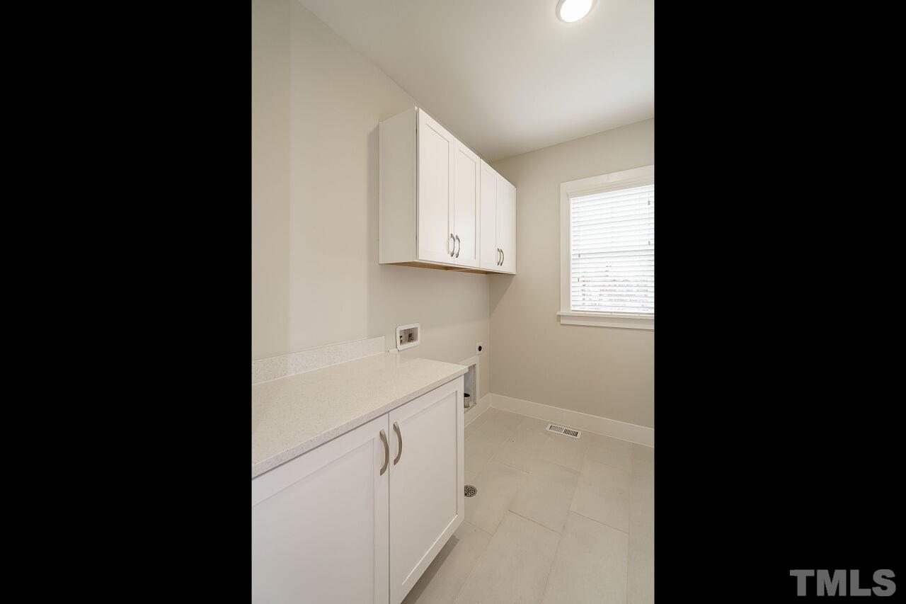 171 Adams Street Cary, NC 27513 - Photo 26 of 32 a view of cabinets and window