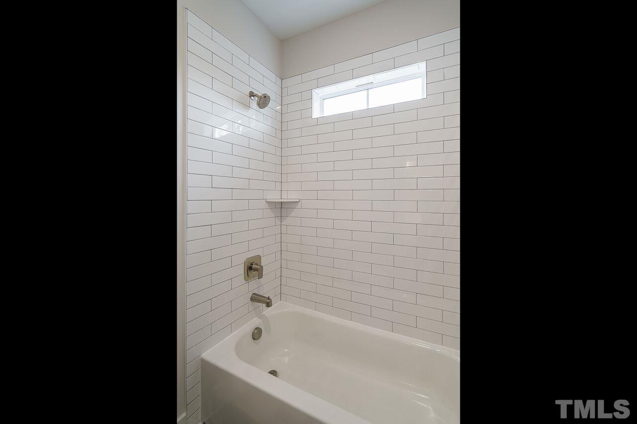 171 Adams Street Cary, NC 27513 - Photo 28 of 32 a bathroom with a bathtub