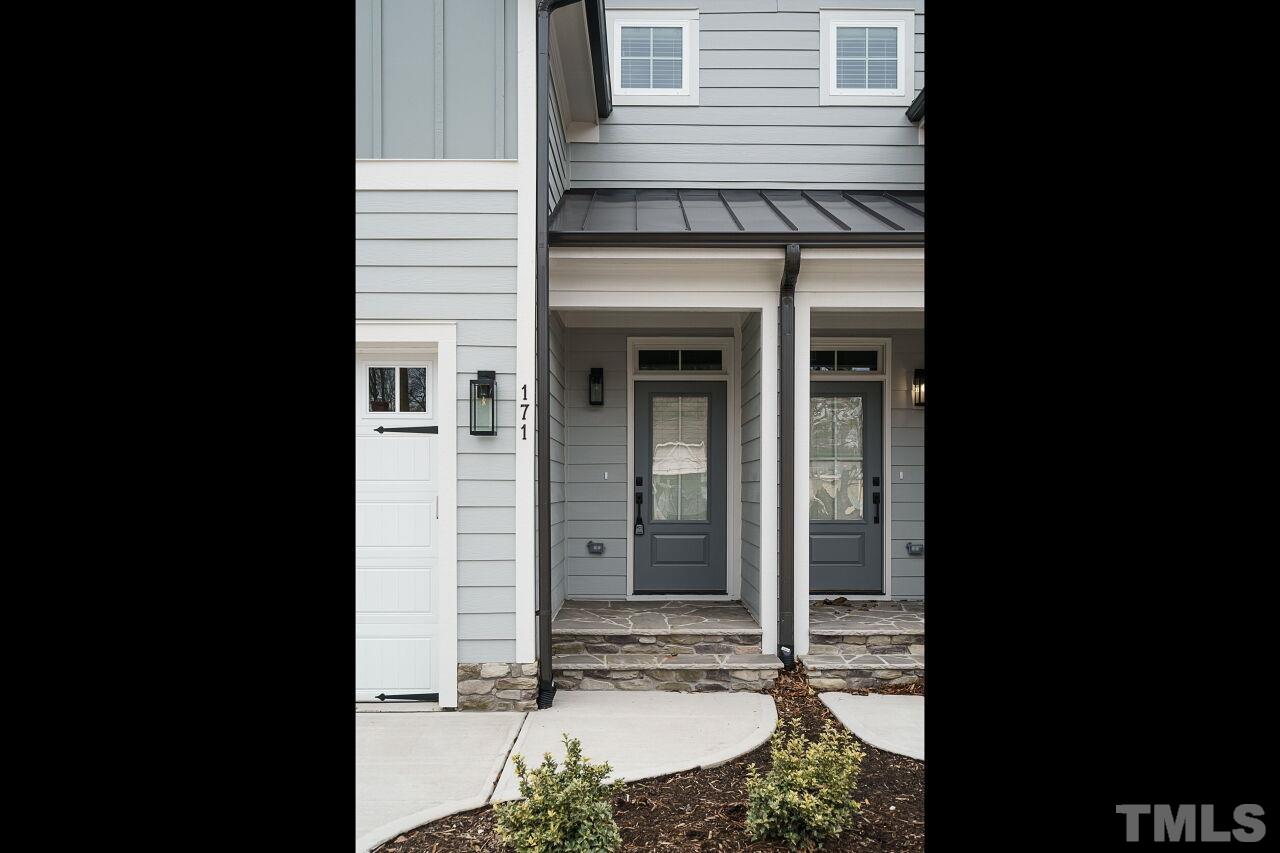 171 Adams Street Cary, NC 27513 - Photo 3 of 32 a view of a entryway door of the house