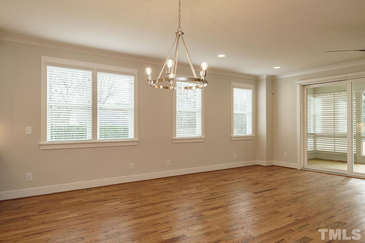 171 Adams Street Cary, NC 27513 - Photo 10 of 32 wooden floor in an empty room with a window