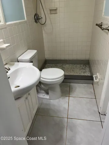 a bathroom with a toilet and a sink