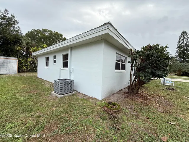 a backyard of a house with lots of green space