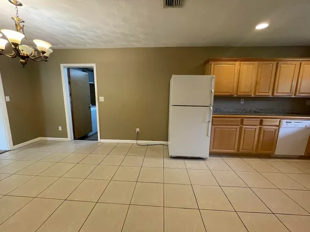 a view of a kitchen with an empty space