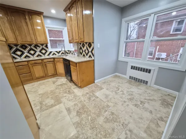 a view of a kitchen with furniture and a window