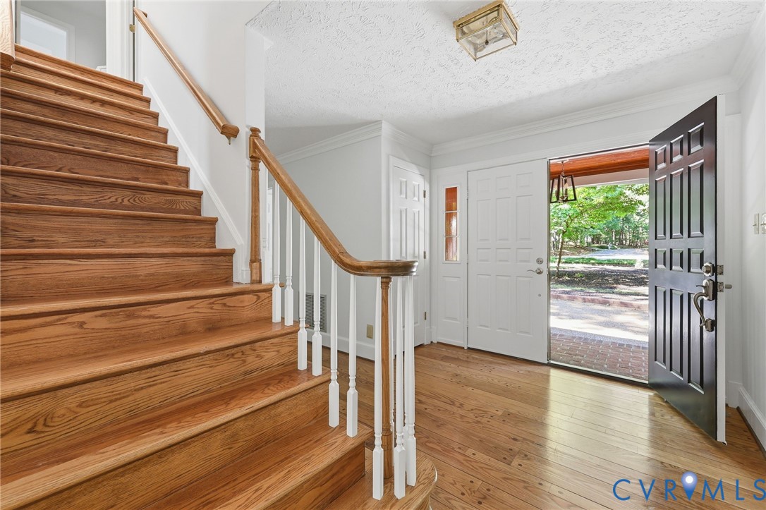 3201 East Brigstock Road Midlothian, VA 23113 - Photo 11 of 72 a view of entryway and hall with wooden floor