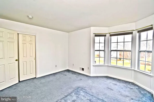 an empty room with windows