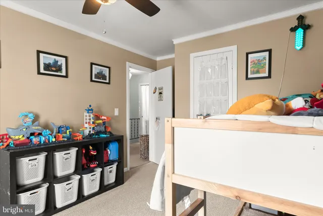 a view of kitchen with cabinets and window