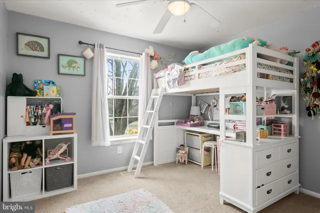 a view of kitchen with fridge and workspace