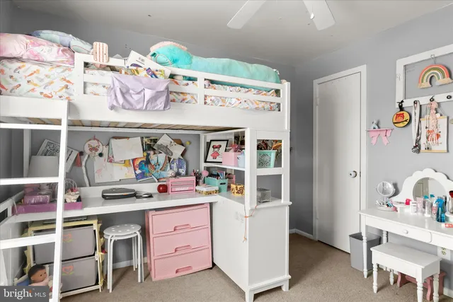 a bathroom with a toilet sink vanity and mirror