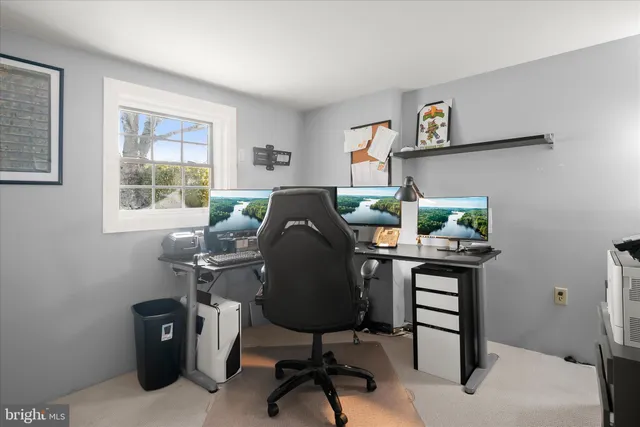 a view of a workspace with furniture