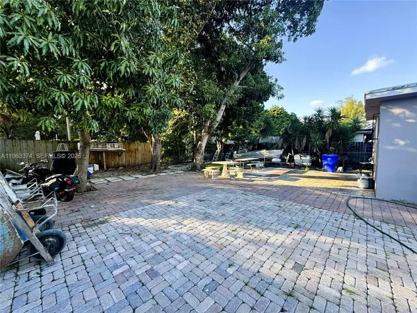 a view of outdoor space with garden and sitting area