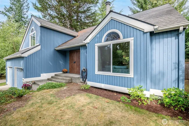 a front view of a house with garden