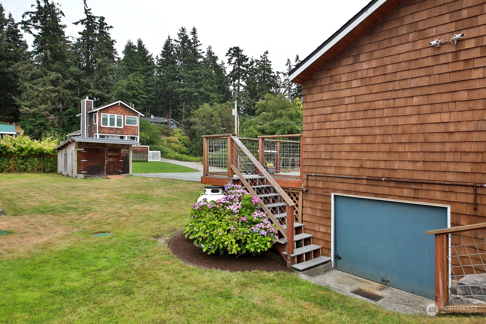 5818 Mutiny Bay Road Freeland, WA 98249 - Photo 12 of 40 a front view of a house with garden