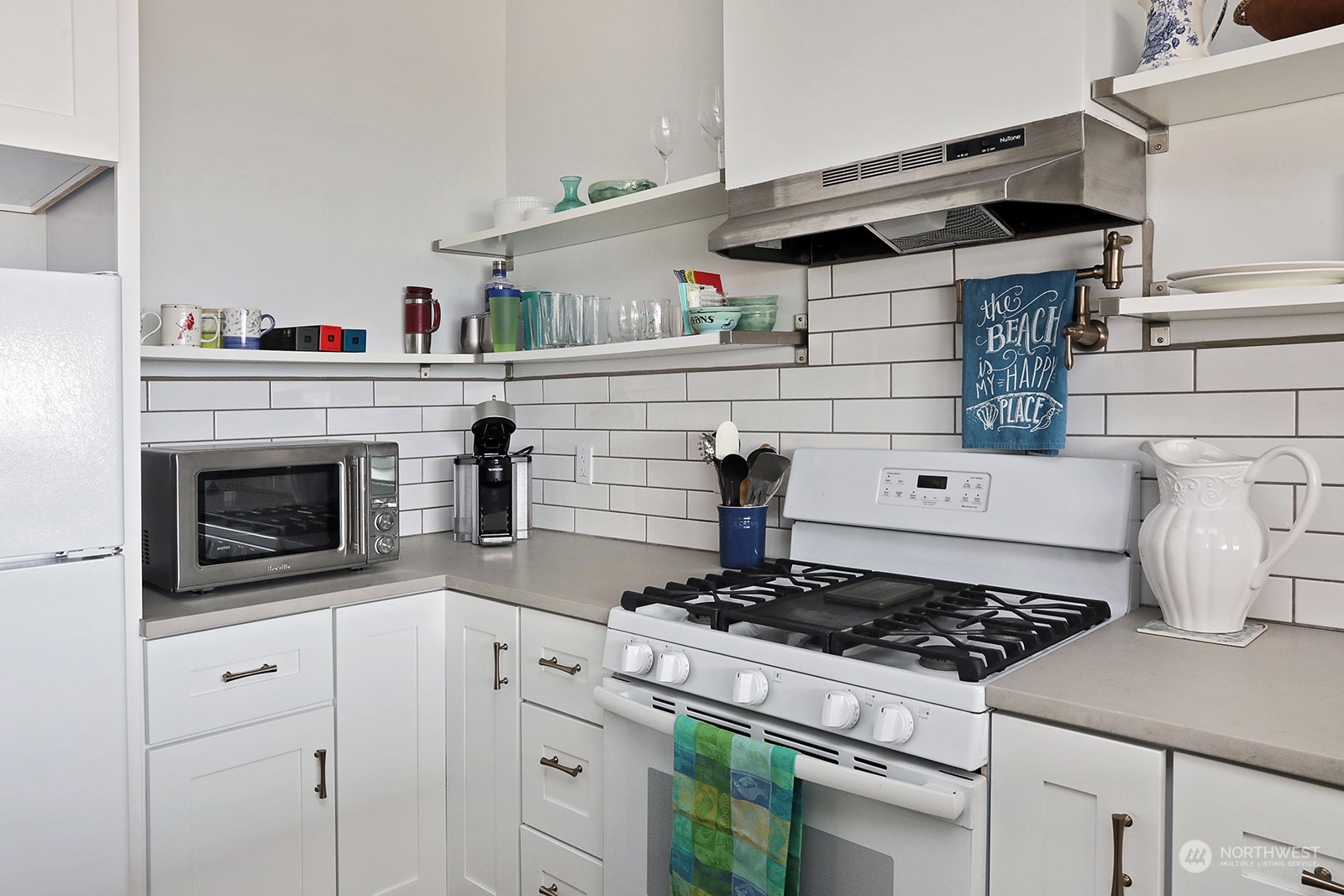 5818 Mutiny Bay Road Freeland, WA 98249 - Photo 20 of 40 a stove top oven sitting inside of a kitchen
