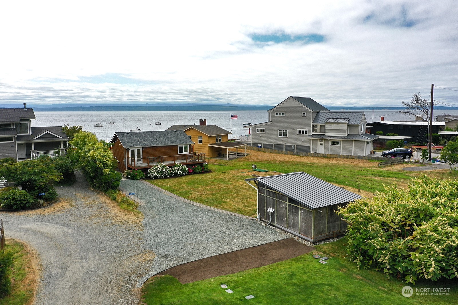 5818 Mutiny Bay Road Freeland, WA 98249 - Photo 7 of 40 an aerial view of a house with swimming pool garden and patio