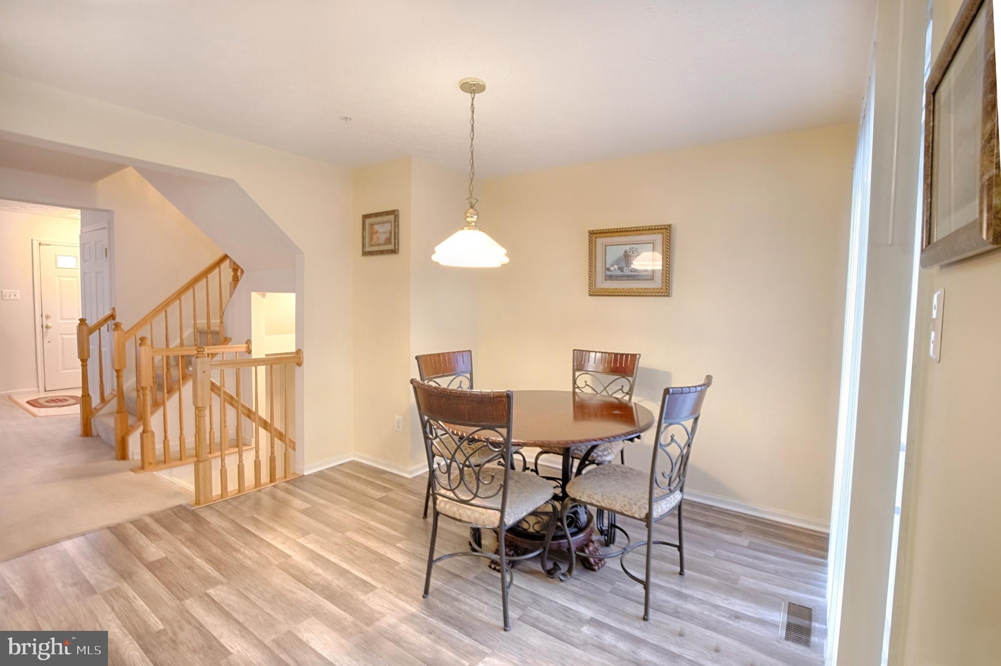 5034 Finsbury Road Baltimore, MD 21237 - Photo 3 of 23 New vinyl flooring in eat in kitchen table space
