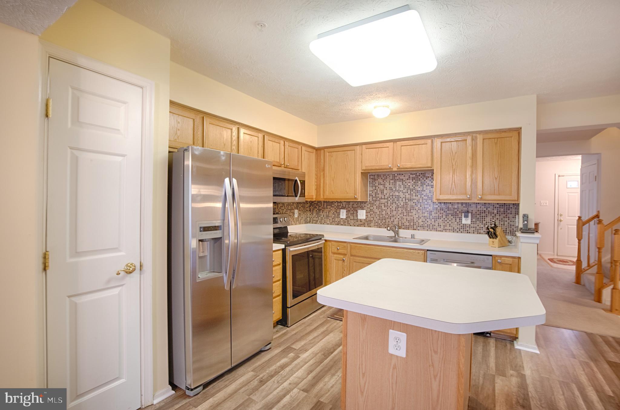 5034 Finsbury Road Baltimore, MD 21237 - Photo 5 of 23 New SS appl, back splash & pantry for storage!
