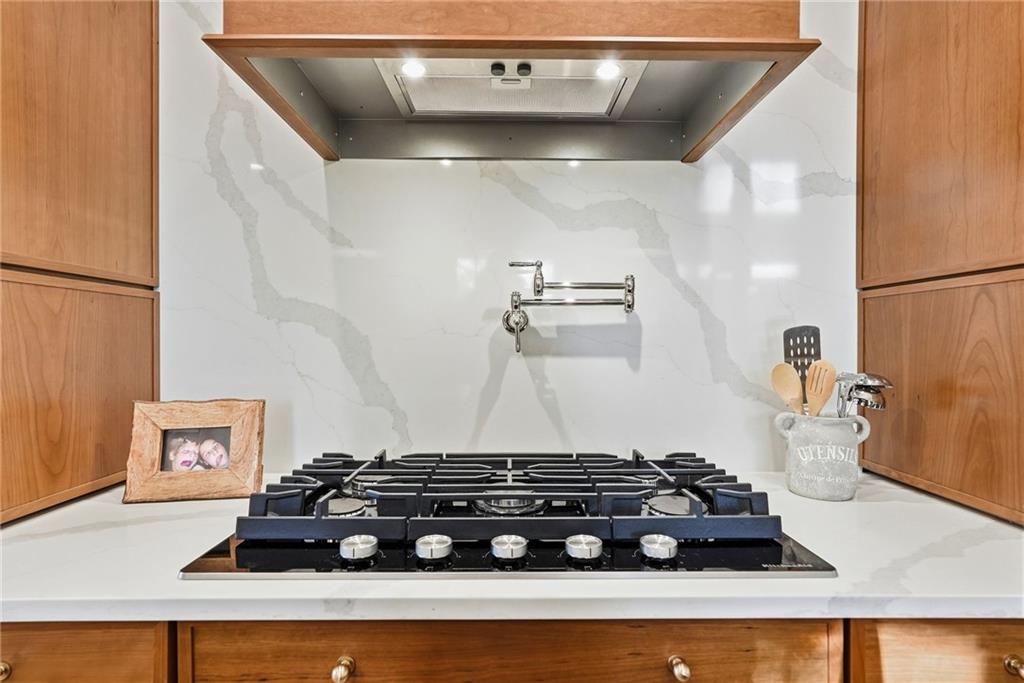 3944 Bakerstown Road Gibsonia, PA 15044 - Photo 29 of 50 a kitchen with a stove and a cabinet
