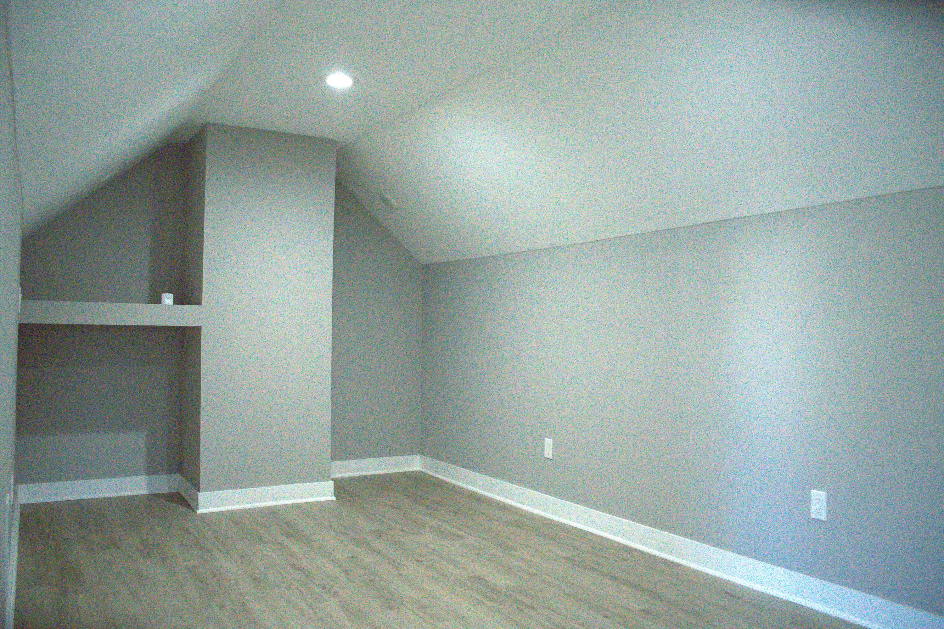 864 Ohio Street Gary, IN 46402 - Photo 12 of 27 an empty room with wooden floor and entrance