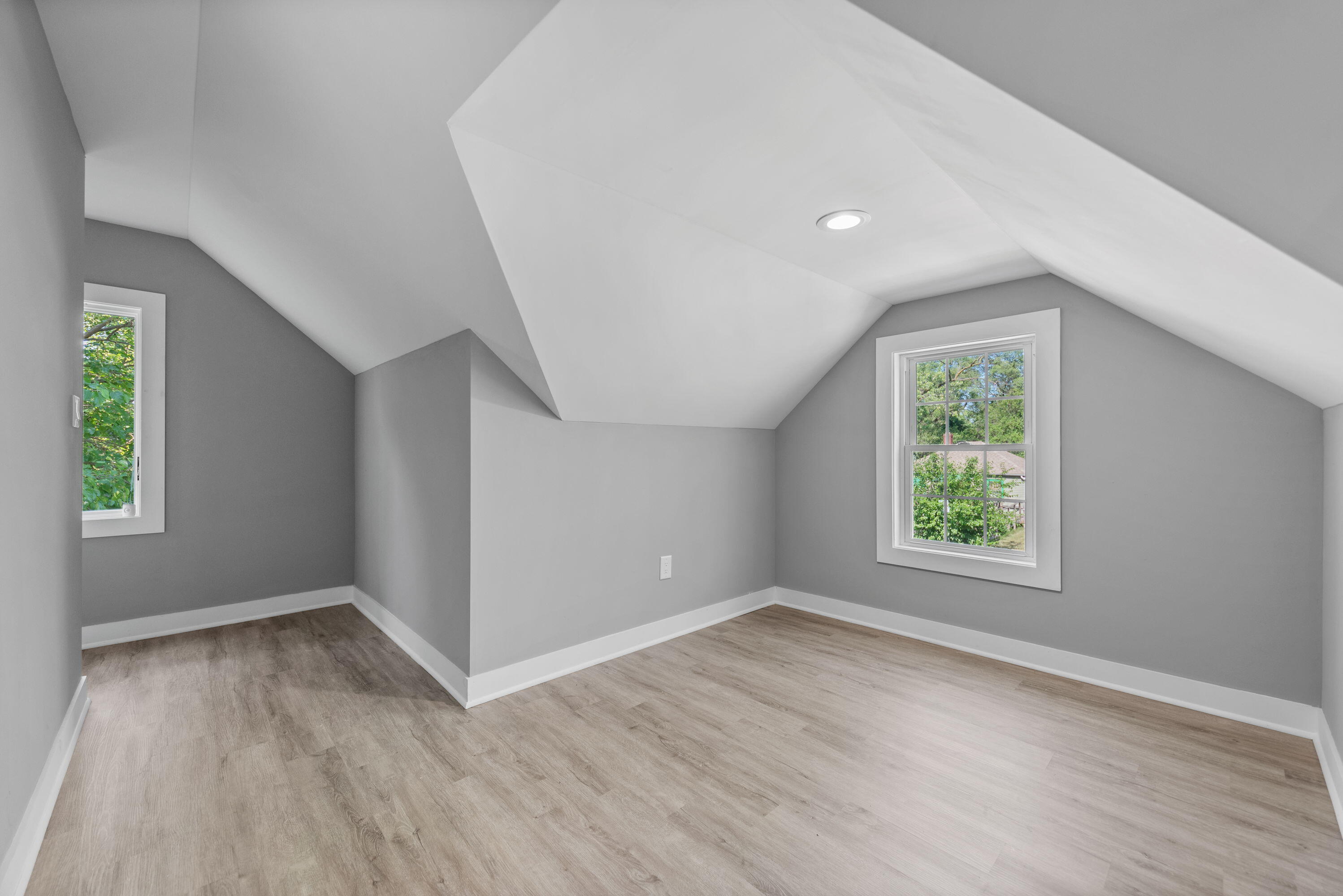 864 Ohio Street Gary, IN 46402 - Photo 14 of 27 an empty room with wooden floor and windows