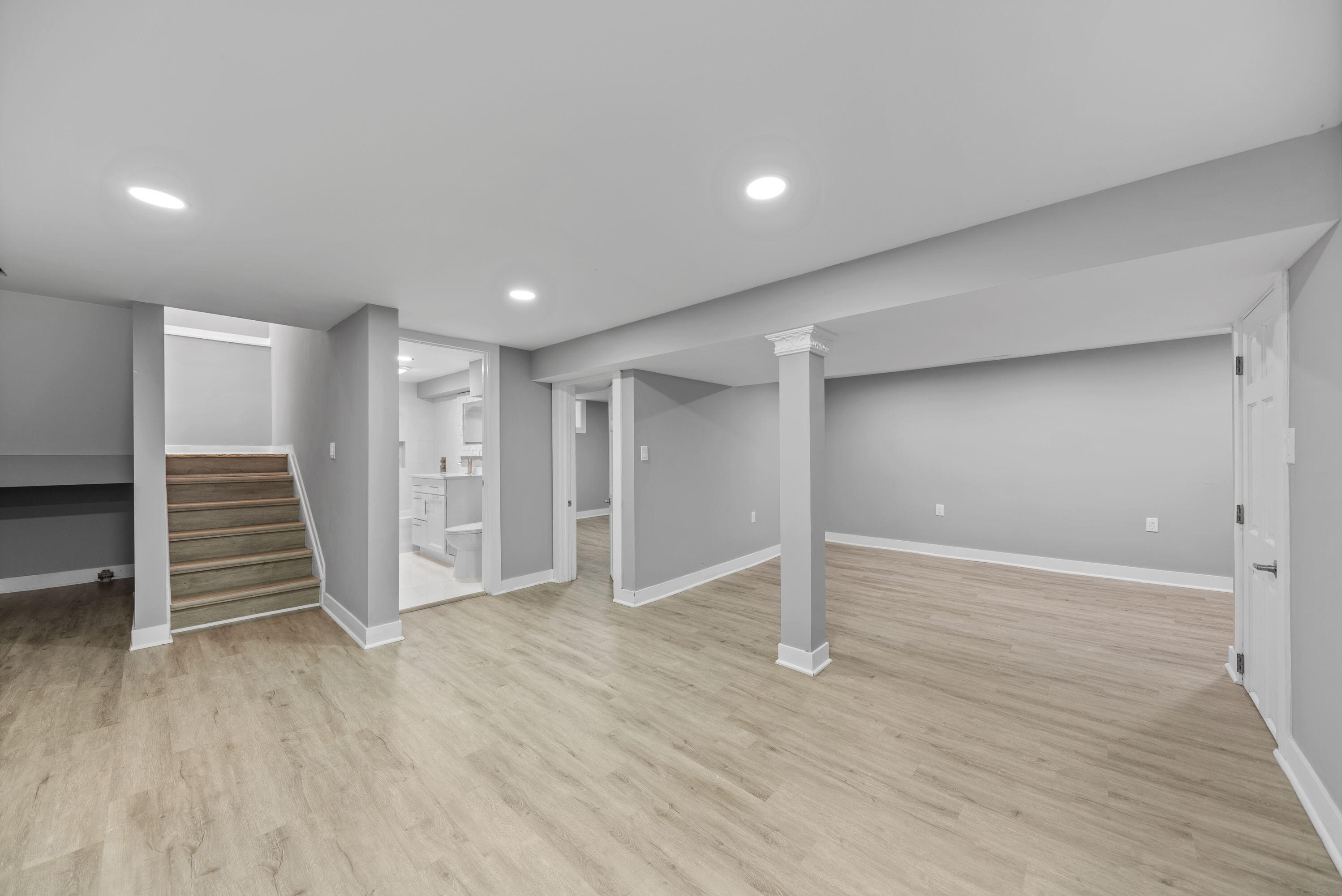 864 Ohio Street Gary, IN 46402 - Photo 16 of 27 a view of wooden floor and stairs in a room