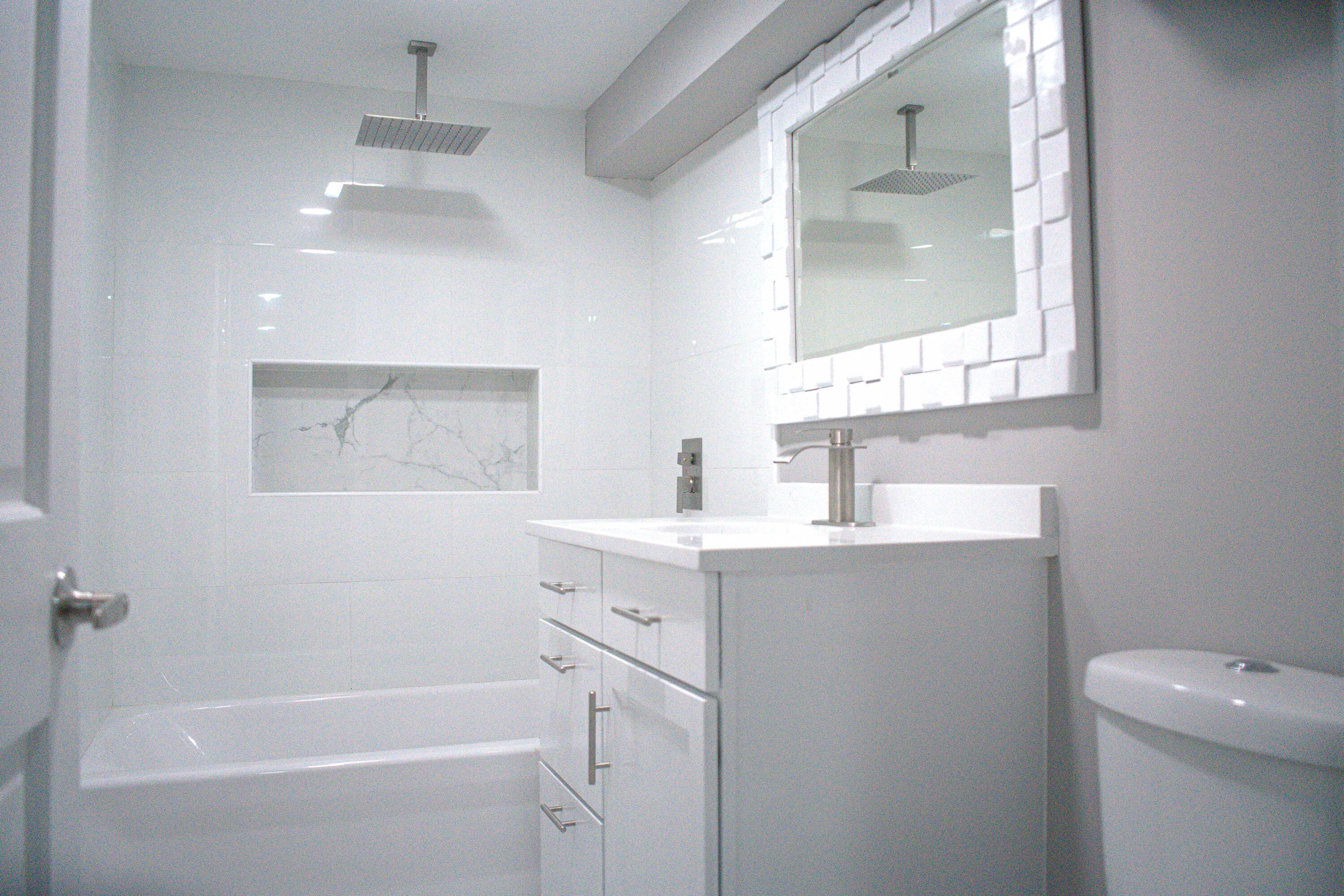 864 Ohio Street Gary, IN 46402 - Photo 20 of 27 a bathroom with a sink a toilet and shower