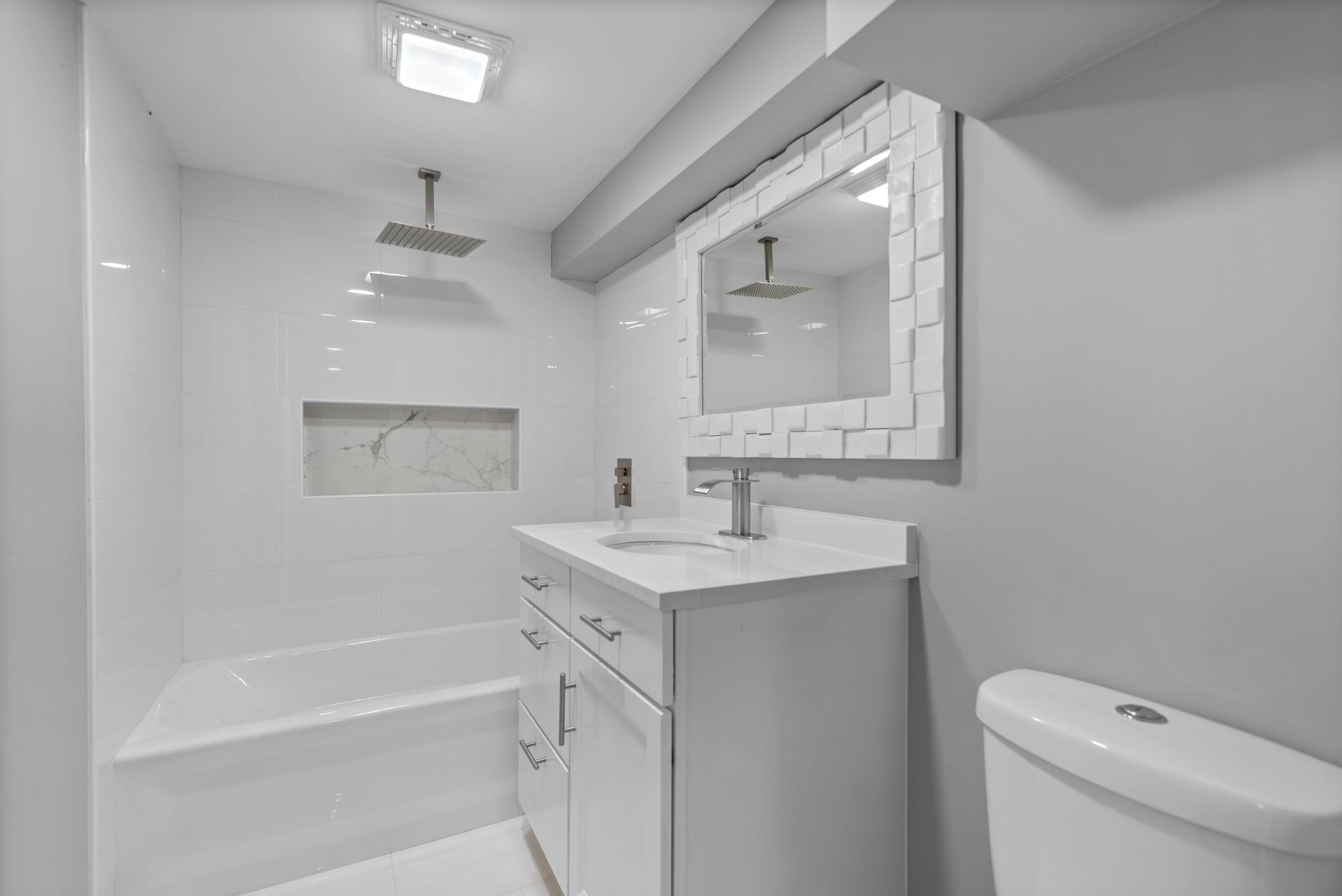 864 Ohio Street Gary, IN 46402 - Photo 21 of 27 a bathroom with a sink a toilet and shower