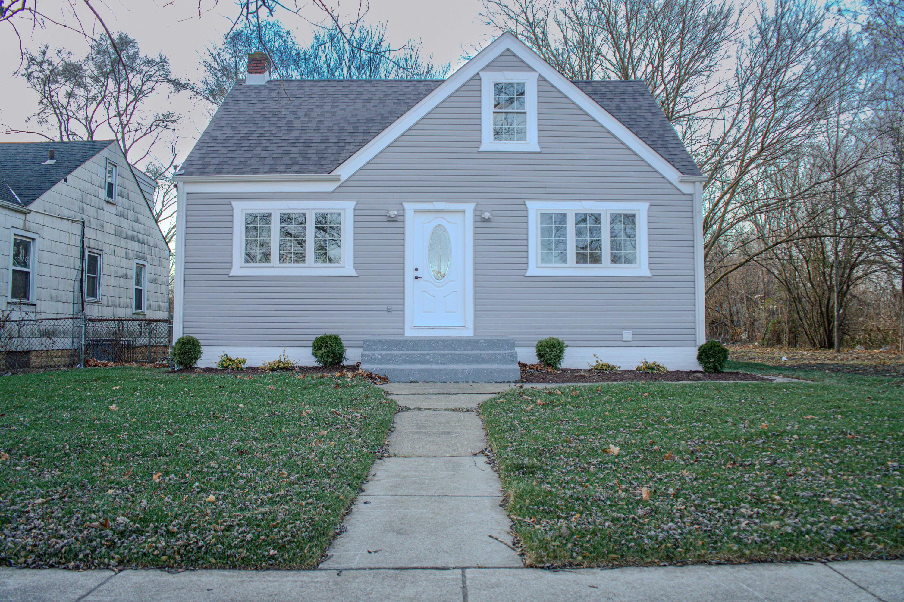 864 Ohio Street Gary, IN 46402 - Photo 25 of 27 a front view of a house with a yard