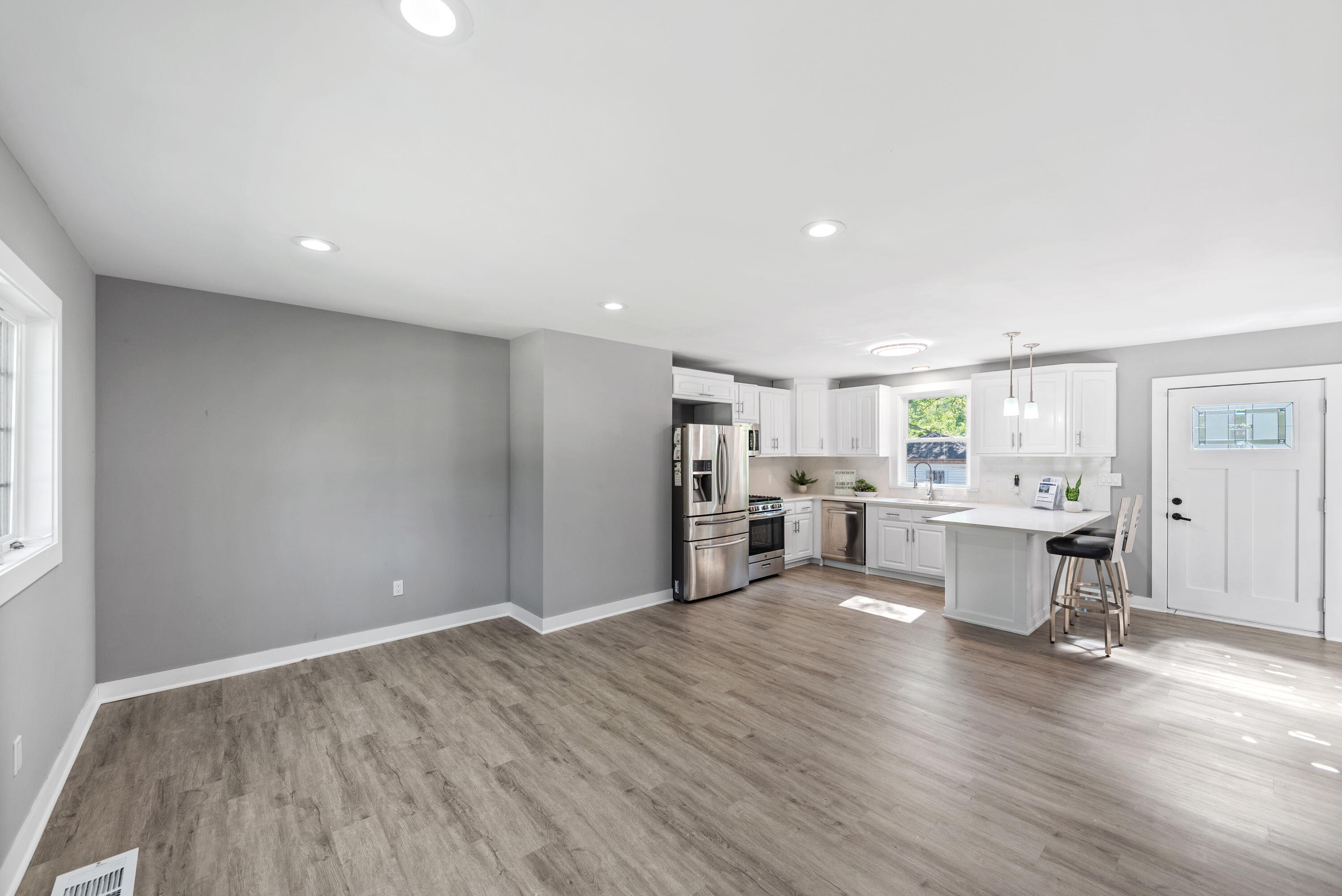 864 Ohio Street Gary, IN 46402 - Photo 4 of 27 a view of a kitchen with furniture and wooden floor