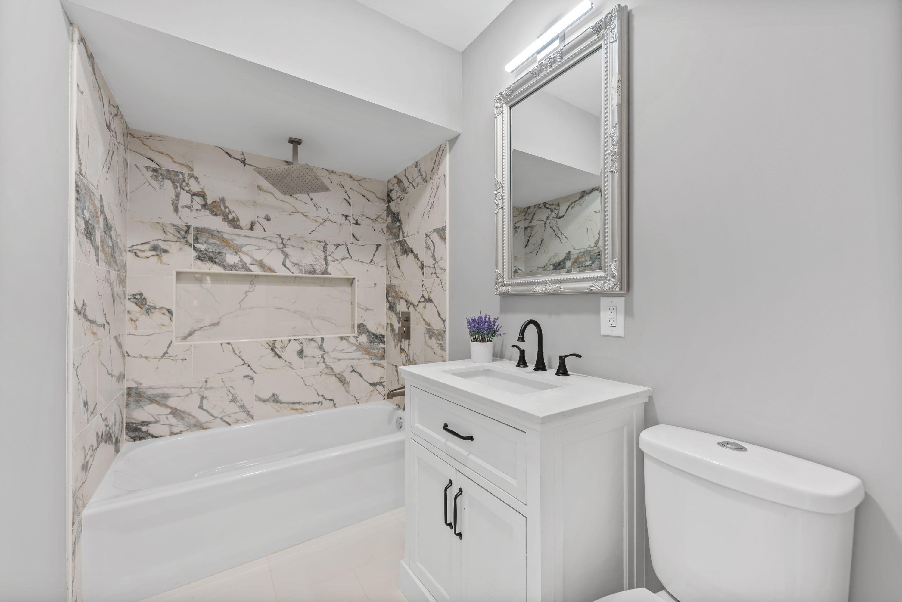 864 Ohio Street Gary, IN 46402 - Photo 10 of 27 a bathroom with a sink toilet and shower