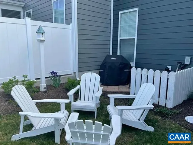 a view of a balcony with furniture