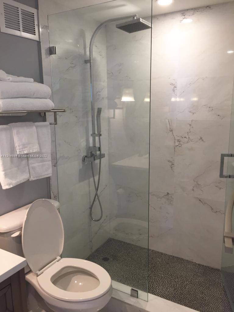 100 Lincoln Road, Unit 1225 Miami Beach, FL 33139 - Photo 9 of 10 a bathroom with a toilet and a shower
