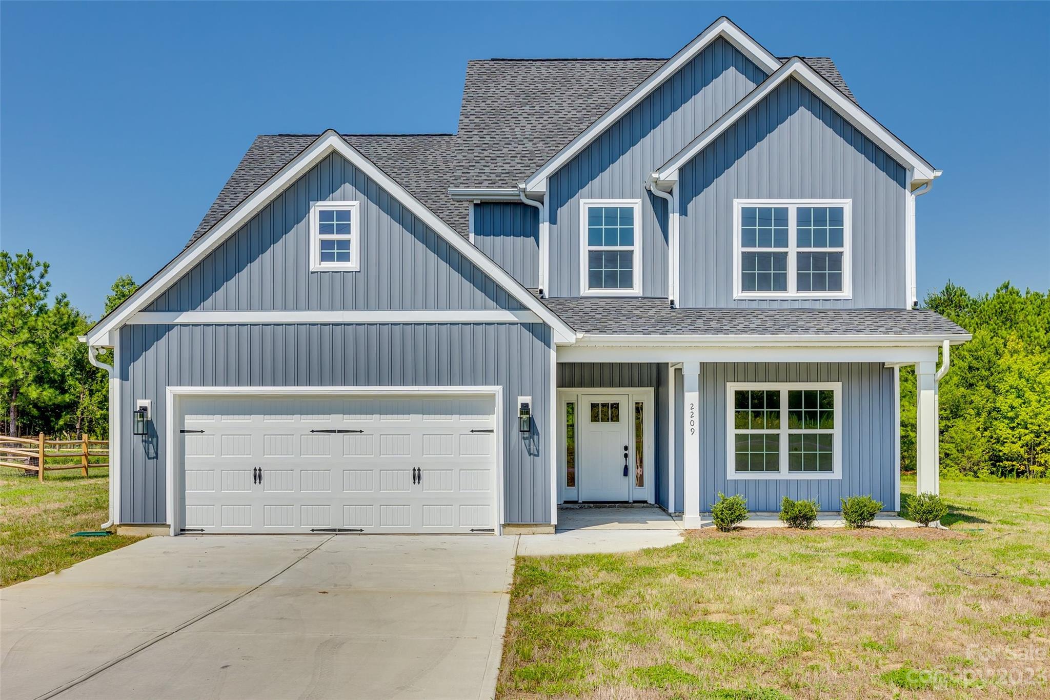 2209 State Rd S-46-1474, Unit 14 Clover, SC 29710 - Photo 1 of 33 a front view of a house with a yard and garage