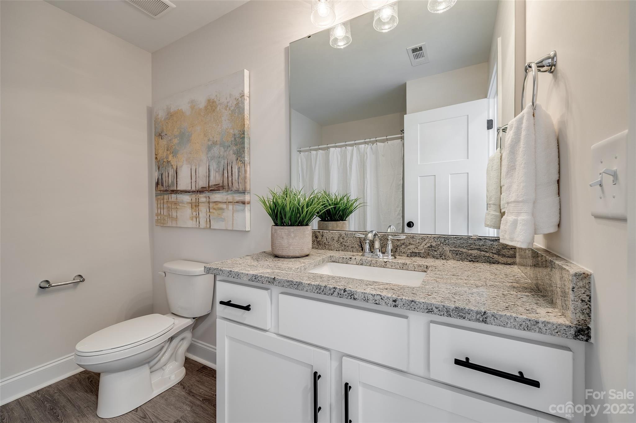 2209 State Rd S-46-1474, Unit 14 Clover, SC 29710 - Photo 27 of 33 a bathroom with a granite countertop toilet sink and mirror