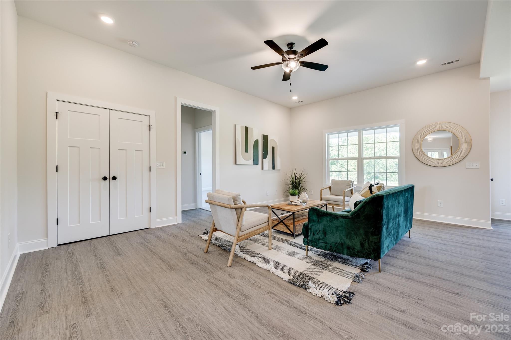 2209 State Rd S-46-1474, Unit 14 Clover, SC 29710 - Photo 7 of 33 a living room with furniture and a wooden floor